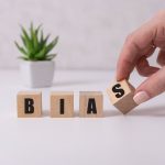 female-hands-holding-wooden-cubes-with-the-text-bias