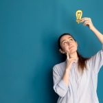 front-view-woman-holding-idea-light